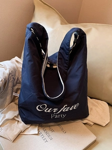 Navy blue striped canvas tote bag with white party text print and durable shoulder straps