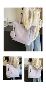 Details einer lavendelfarbenen Nylontasche mit Steckfächern und kleinem runden Geldbeutel