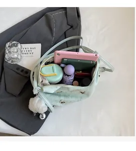 Macro view of mint green backpack interior showing spacious storage for tablet and daily items