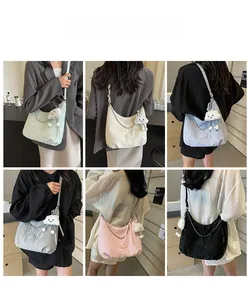 Collage of colorful crescent hobo bags featuring metallic chain and plush cloud charm detail
