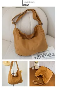 Detail view of a large brown canvas messenger bag with adjustable strap for daily use