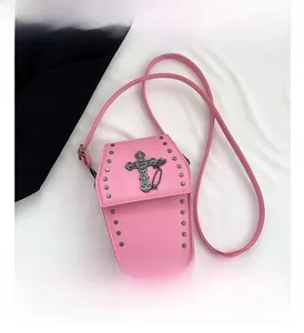 Pink coffin-shaped cross body bag with gothic cross pendant and metal rivet details
