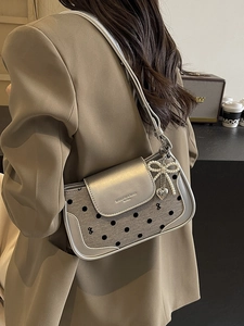 Chic silver baguette shoulder bag with black polka dots and pearl bow charm accessory