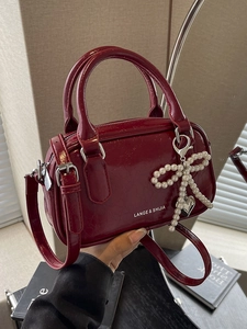 Burgundy oil wax leather pillow bag with pearl bow pendant and adjustable strap