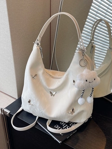 White soft leather large capacity hobo bag with silver butterfly charms and plush pendant