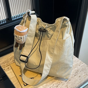 Large cream nylon tote bag with drawstring closure and cute coffee cup plush charm