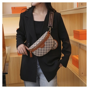 Detail of checkered crossbody chest bag with adjustable strap and detachable coin pouch