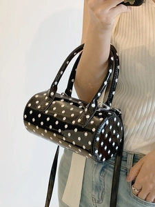 Polka dot patent leather Boston handbag with dual handles and crossbody strap