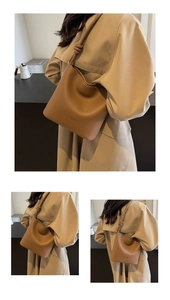 Detail of brown litchi pattern leather bucket bag with unique knotted strap design