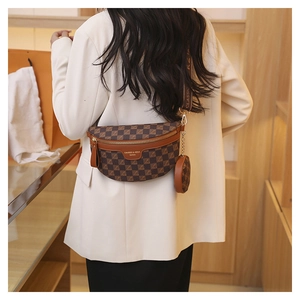 Detailed back view of a brown checkered chest bag with an adjustable wide strap and coin purse