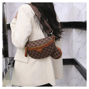 Detailed view of brown checkered crossbody bag with adjustable strap and coin purse