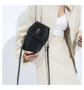 Gothic black coffin-shaped crossbody bag with silver skull detail and metal studs