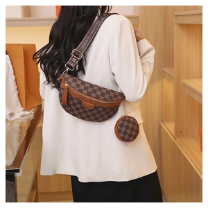 Detail of checkered brown crossbody bag with wide logo strap and mini round pouch charm