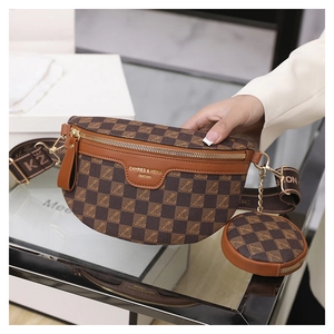 Detail of brown checkered chest bag with a small round coin purse and gold zipper