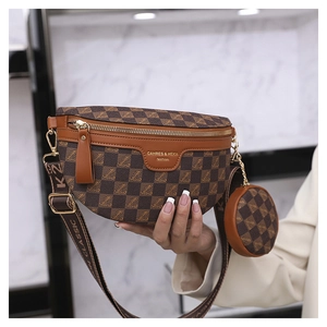Close-up of brown checkerboard chest bag with detachable round coin purse and woven strap