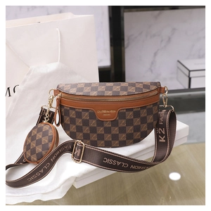 Detail of checkered crossbody bag with detachable round coin purse and jacquard strap