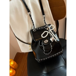 Glossy black chain backpack for women with pearl bow and heart pendant detail