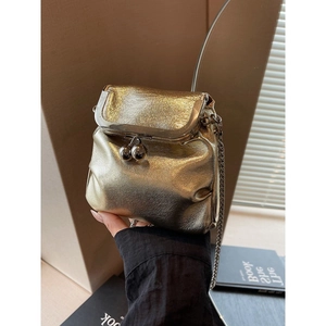 Chic gold textured mini crossbody bucket bag with metallic chain strap for women