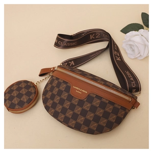 Close-up of brown checkered chest bag with detachable round coin purse and woven strap