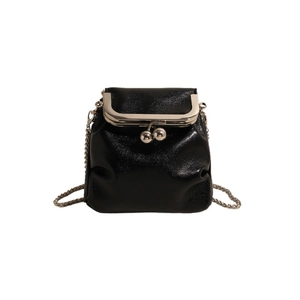 Chic black glossy mini bucket bag with silver kiss-lock closure and metal chain strap