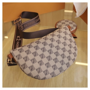Detail of checkered crossbody bag with canvas strap and detachable round coin purse