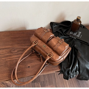 Detailed macro view of the brown retro bowling bag with vintage texture on a wooden desk