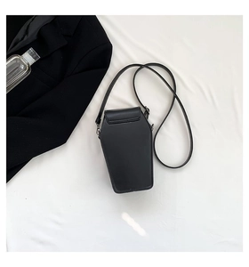 Detailed top view of a black gothic coffin-shaped crossbody bag with a matte PU finish