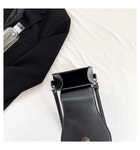 Top view of black gothic rivet crossbody bag showing the magnetic snap and interior compartment