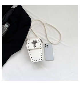 Gothic white leather coffin bag detail with silver studs and a metallic cross charm