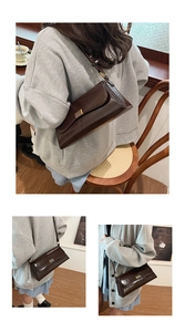 Detail shots of a vintage brown leather underarm bag with a gold square buckle