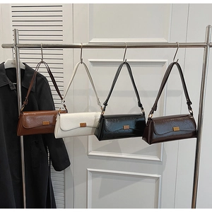 Detail shot of vintage baguette bags in multiple colors with metallic gold clasps