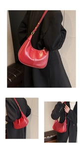 Three-angle views of a retro red glossy leather crescent bag with gold-tone hardware