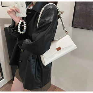 Minimalist white leather rectangular shoulder bag with vintage metal buckle detail