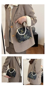 Detalle de bolso bordado estilo chino con asa de perlas y motivos de bambú y flores