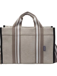 Minimalist canvas tote bag with brown striped handles and black trim on white background