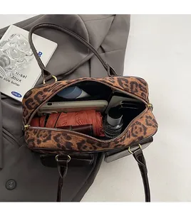 Top view of leopard print tote bag interior showing capacity for umbrella and wallet