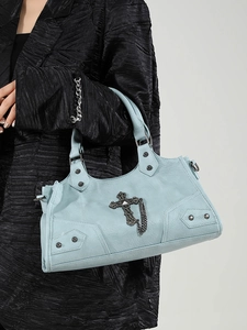 Light blue biker style handbag with metallic cross charms and punk rivet details
