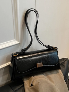 Classic black glossy pleated faux leather shoulder bag with gold hardware and flap closure