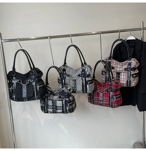 Detailed display of assorted Gothic punk tote bags featuring metal chains and stud straps