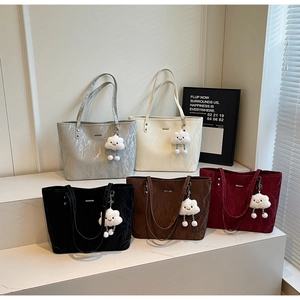 Minimalist tote bags in five colors featuring glossy crinkled texture and cloud charms