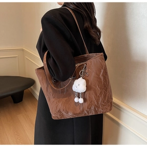 Brown large vintage tote bag with glossy wrinkled texture and a cute cloud charm detail