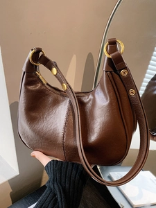 Retro brown half-moon hobo bag with glossy cracked leather and gold hardware