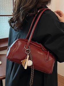 Vintage wine red baguette shoulder bag with contrast stitching and baseball charm