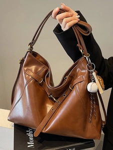 Large brown faux leather tote bag with baseball charm for autumn casual commuting
