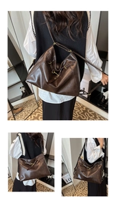 Detail view of large dark brown hobo bag with leather texture and vintage gold hardware