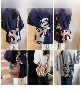 Detail view showing plush leopard and floral crossbody bags with soft lamb wool texture