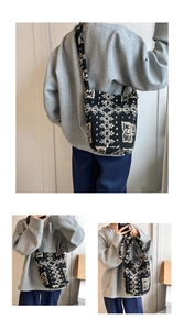 Detail of black and white plush tote bag with vintage ethnic pattern and fleece texture