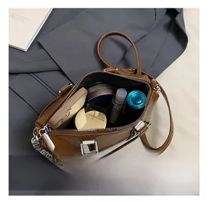 Top view showing the spacious interior capacity of this brown leather chain crossbody bag