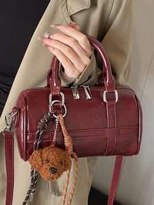Chic dark red PU leather bowling bag with cute dog pendant and woven rope detail