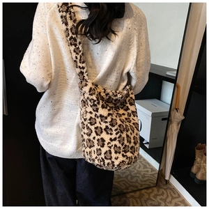 Detail view of plush leopard print tote bag with soft texture and MISS brand label